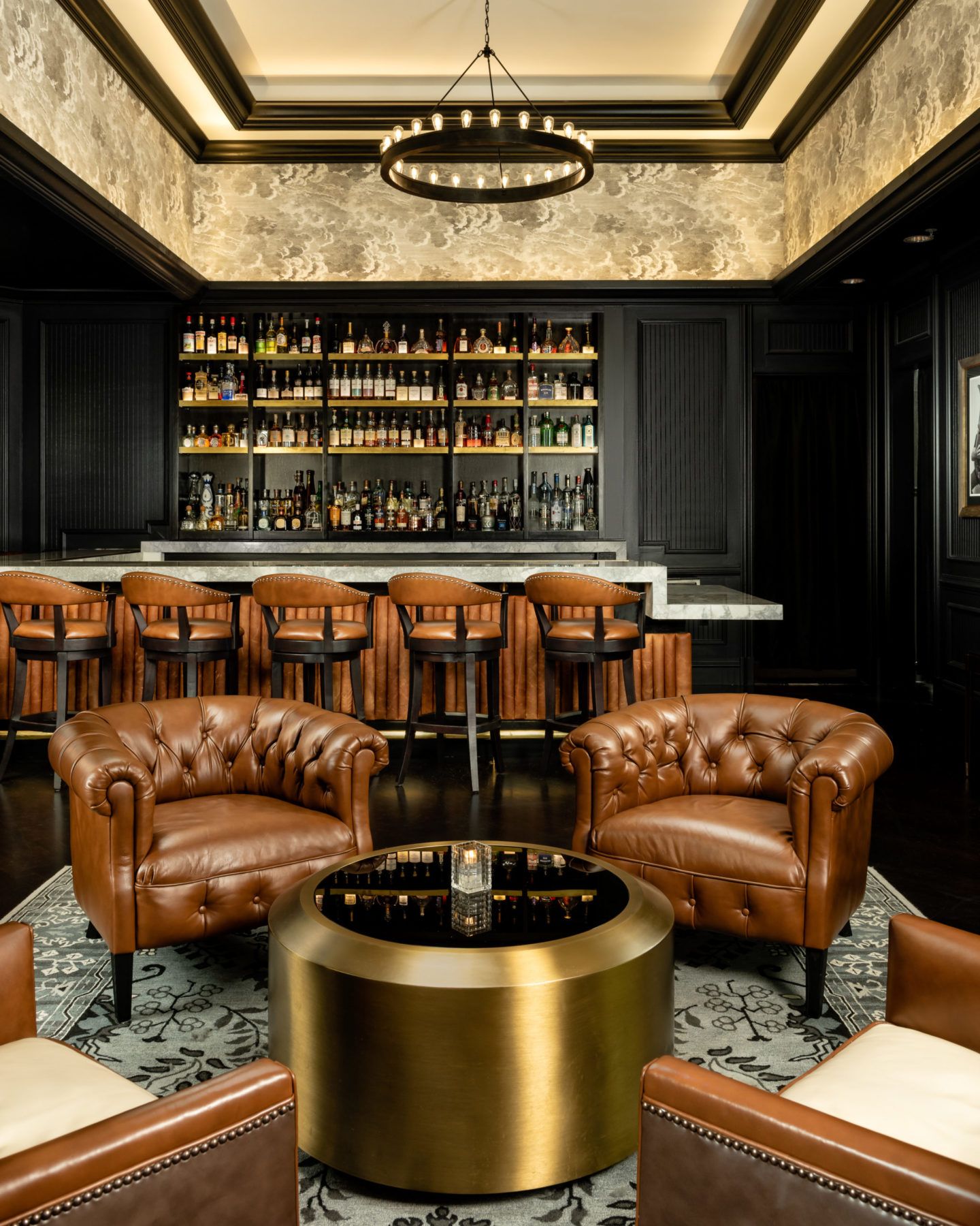 Bar view with bronze and leather furniture at The Commodore